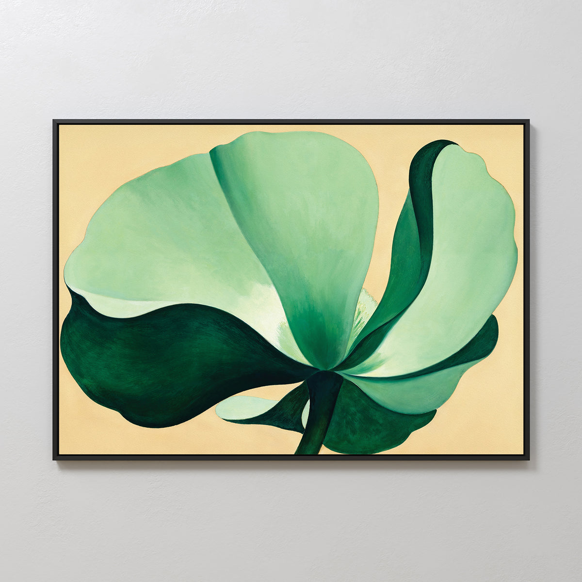 The Tropical Serenity Canvas Art - Horizontal features an abstract green flower with large petals on a beige background, ideal as neutral wall decor and beautifully displayed on a light gray wall.