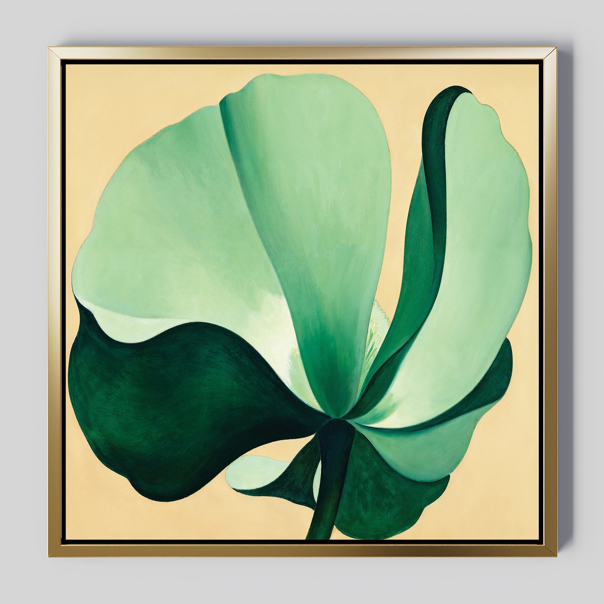Tropical Serenity Canvas Art - Square features a large, abstract green flower with broad petals on soft beige canvas in a gold and black-edged frame—an elegant choice for coastal wall decor.