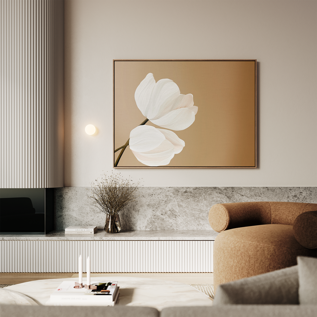 A modern living room with a round brown sofa, marble shelf, vase of dried branches, candles, and the Tulips Abstract Canvas Art on a beige wall. Neutral tones and minimalist wall art create a calm, elegant atmosphere.