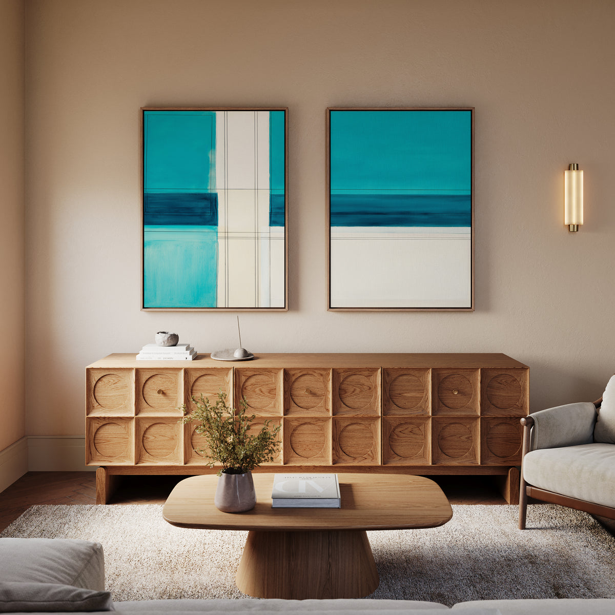 A modern living room features a wooden sideboard, coffee table, light sofa, wall sconce, and the Turquoise Grid - Set Of 2 wall art with contemporary abstract prints for a calm and stylish vibe.