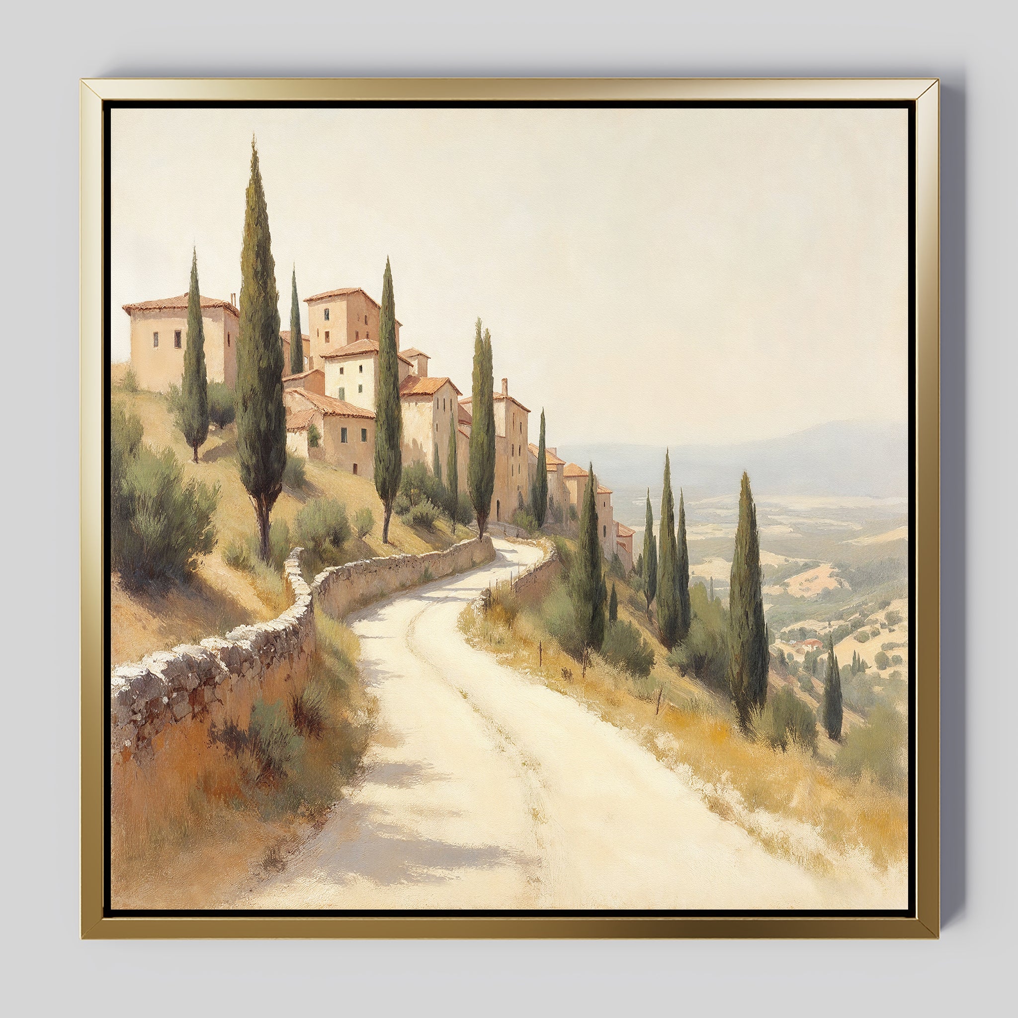 The Tuscan Village Canvas Art - Square features a framed painting of a sunlit road lined with cypress trees leading to terracotta-roofed buildings, capturing the rustic charm and scenic beauty of a rural Tuscan landscape.