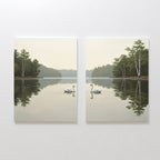 The Twin Swans Serenity - Set Of 2 features two canvas paintings of swans gliding on a tranquil lake, with reflected trees and a misty ambiance—ideal for adding calm, Nordic-inspired decor to your home.