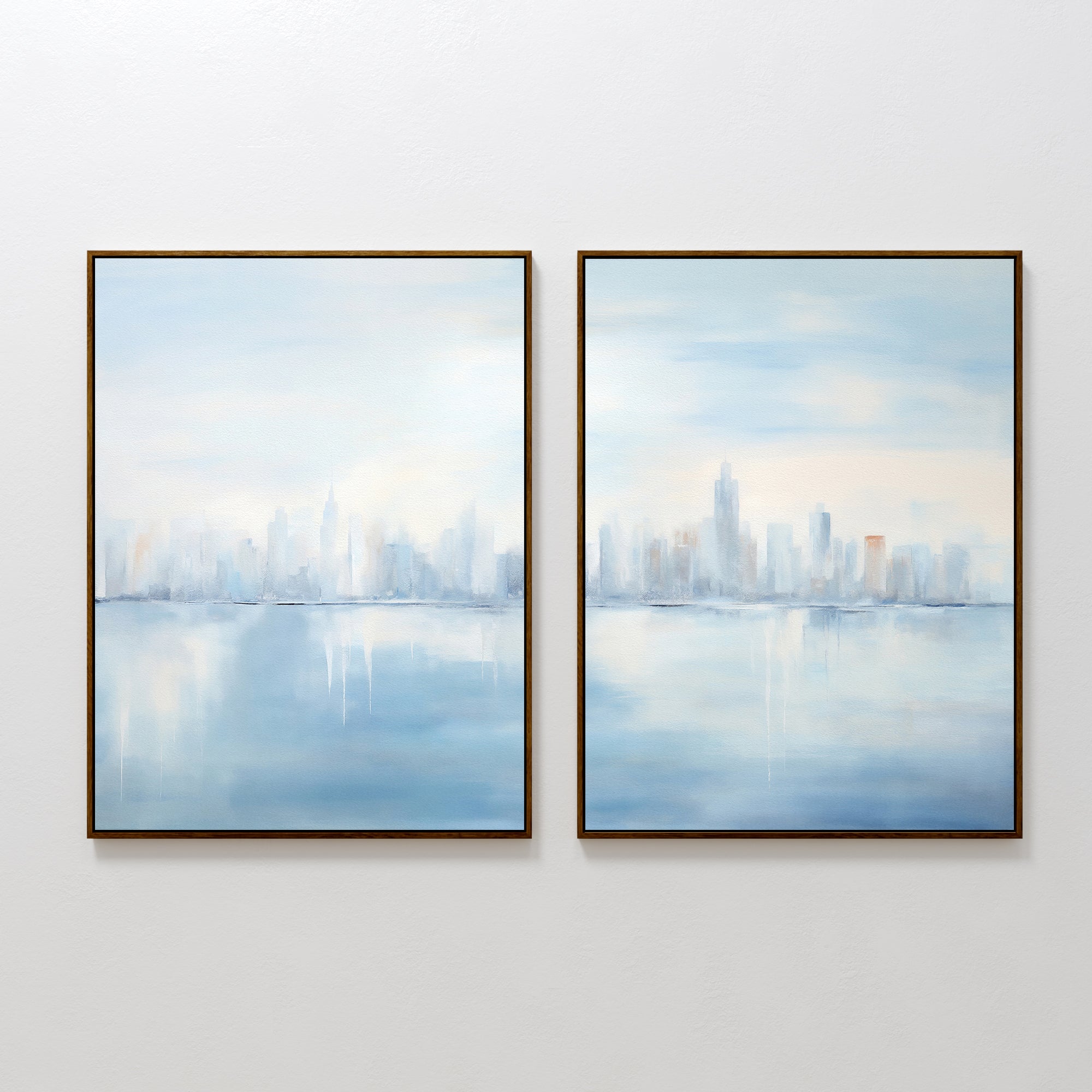Urban Mirage – Set of 2 features framed abstract city skyline art reflected over calm water in soft blue, white, and pastel tones—ideal minimalist wall decor for creating a serene, modern living room atmosphere.