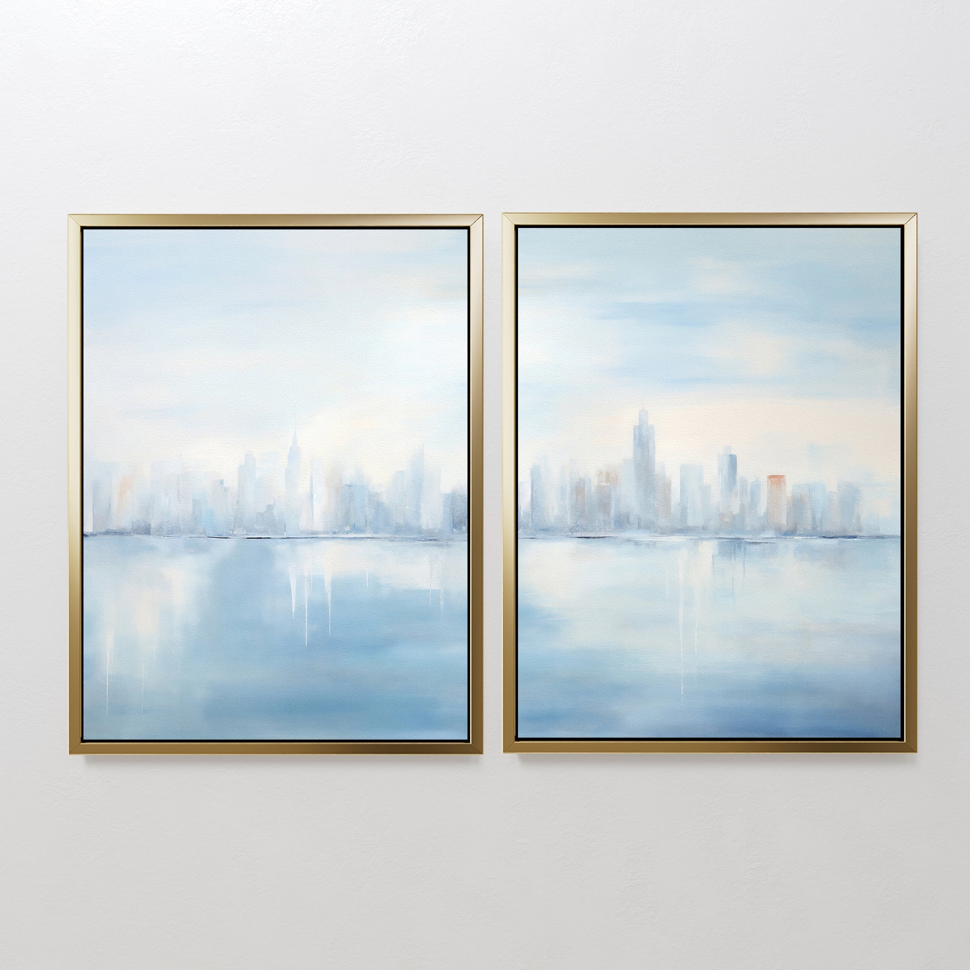 The Urban Mirage - Set of 2 features two framed canvas prints showcasing a soft, abstract city skyline in blue, white, and gray with water reflections—ideal for adding a calm, modern touch to your living room decor.