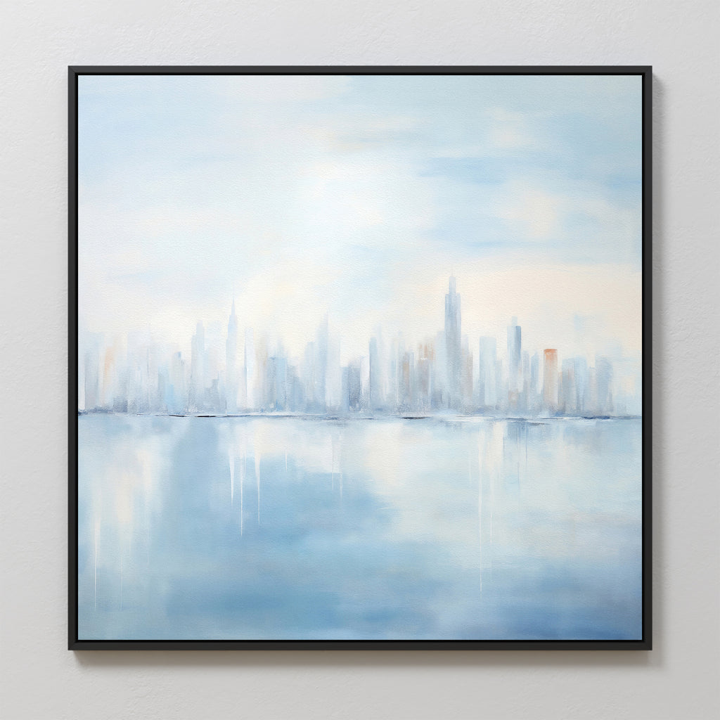 Urban Mirage Canvas Art - Square features a dreamy city skyline with tall buildings reflected on calm water in soft blue, white, and gray tones. Framed in black, it’s ideal modern wall decor for your living room.