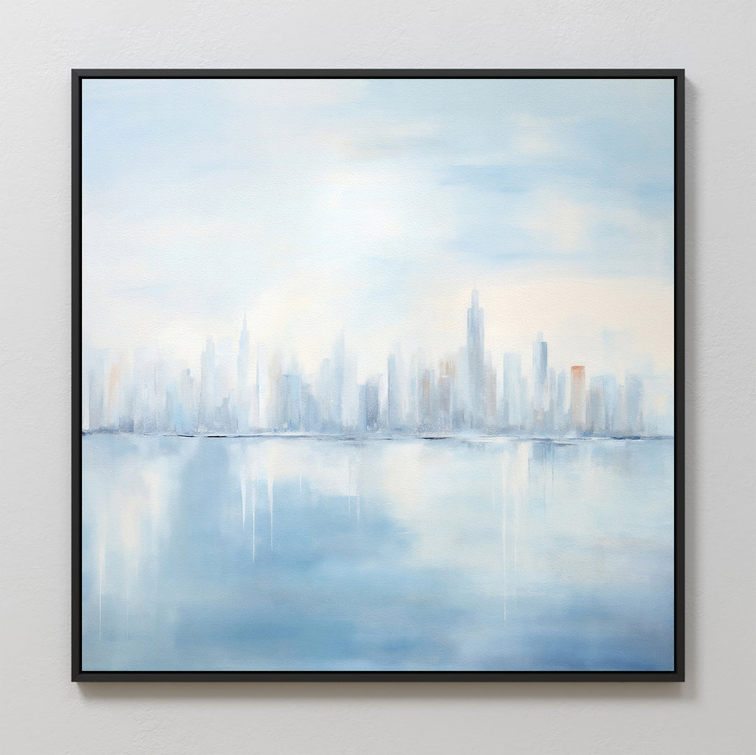 Urban Mirage Canvas Art - Square features a dreamy city skyline with tall buildings reflected on calm water in soft blue, white, and gray tones. Framed in black, it’s ideal modern wall decor for your living room.