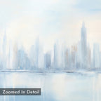 Urban Mirage Canvas Art - Square features a soft, pastel watercolor city skyline with tall, blurred skyscrapers mirrored on water in airy blue and gray tones. Ideal as modern living room wall decor. "Zoomed In Detail" text is in the corner.