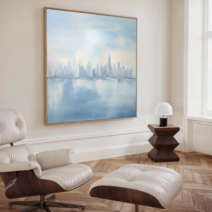 The Urban Mirage Canvas Art - Square adorns the wall, adding a touch of modern style and city skyline flair to your living room decor.