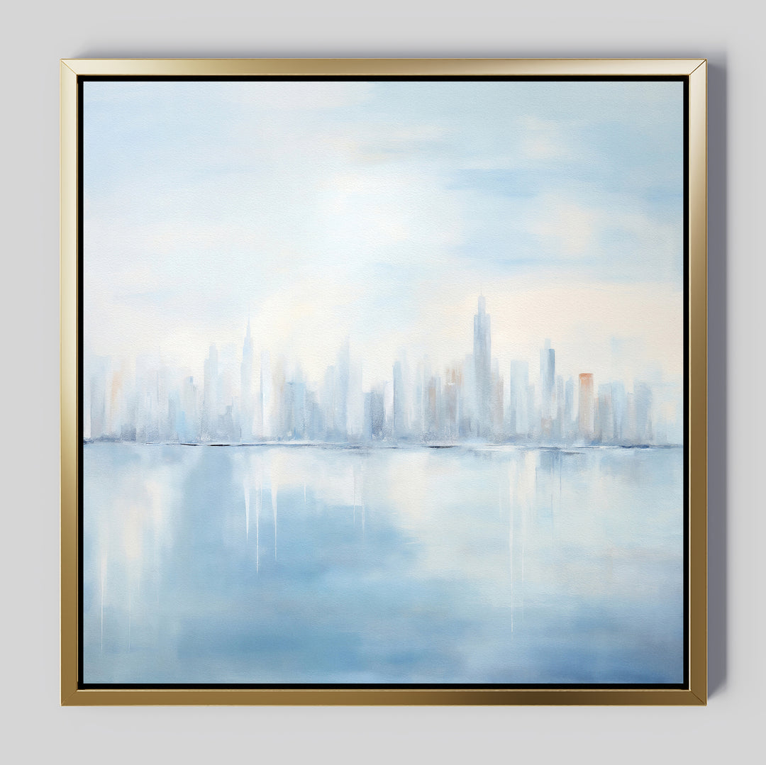 The Urban Mirage Canvas Art - Square showcases a dreamy city skyline reflected on calm water in soft blue, gray, and white tones with an impressionistic style—perfect as modern wall decor for your living room.