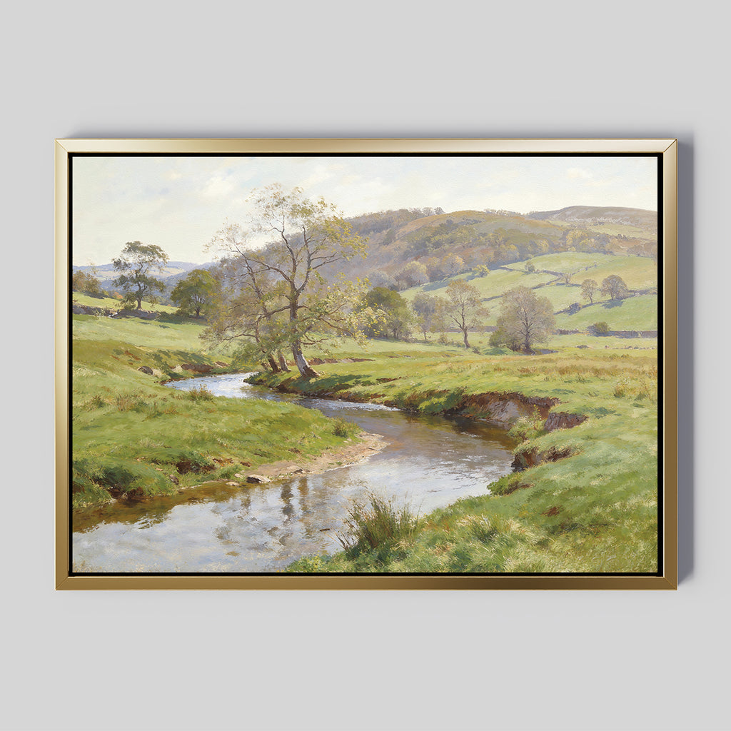 The Valley Stream Canvas Art - Horizontal showcases a peaceful countryside with a gentle river winding through green fields and rolling hills beneath a partly cloudy sky.
