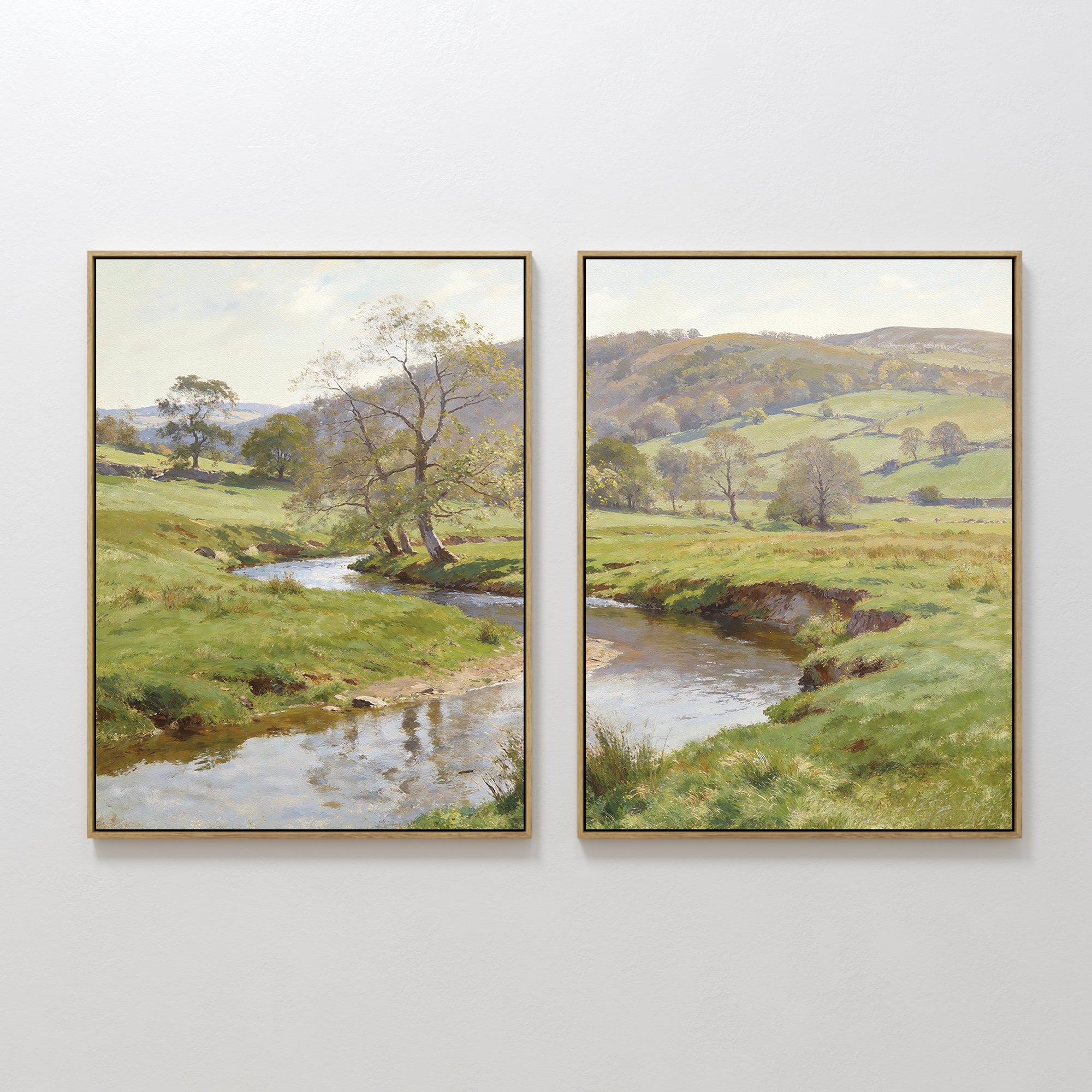 Valley Stream - Set of 2: Two framed landscape prints featuring a tranquil rural scene with a winding river, lush green fields, trees, and rolling hills under a partly cloudy sky. Perfect serene wall art for any room.