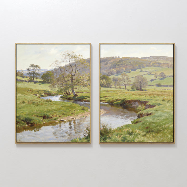 Valley Stream - Set of 2: Two framed landscape prints featuring a tranquil rural scene with a winding river, lush green fields, trees, and rolling hills under a partly cloudy sky. Perfect serene wall art for any room.