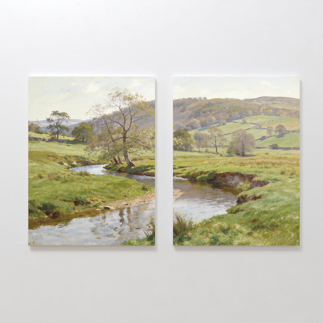 The Valley Stream - Set of 2 showcases side-by-side canvas paintings featuring a serene countryside with a winding river, lush green banks, scattered trees, and gentle hills beneath a luminous sky.