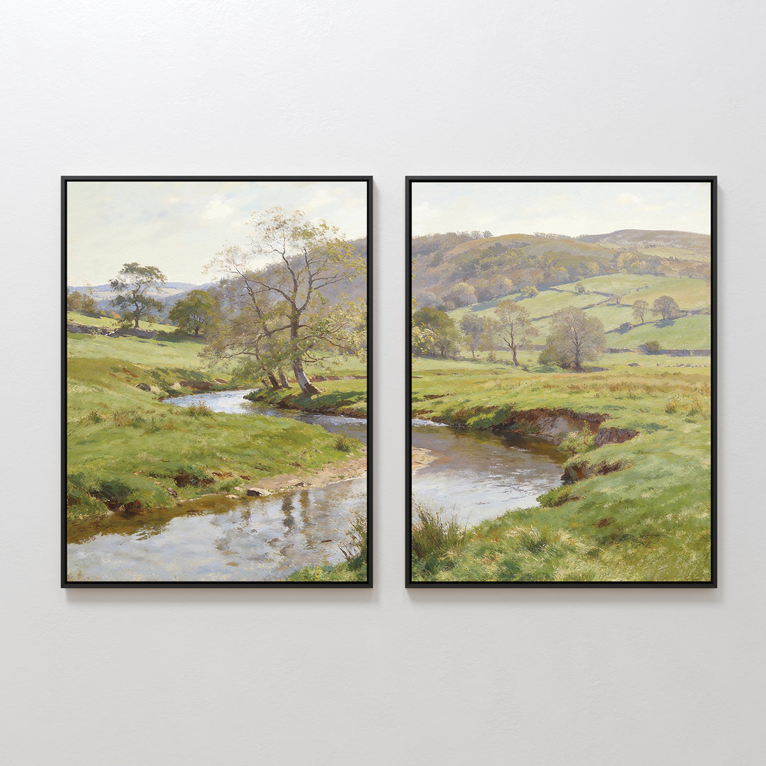 Valley Stream - Set of 2 features framed paintings depicting a countryside landscape with a flowing river, green hills, scattered trees, and distant rolling hills under a partly cloudy sky.