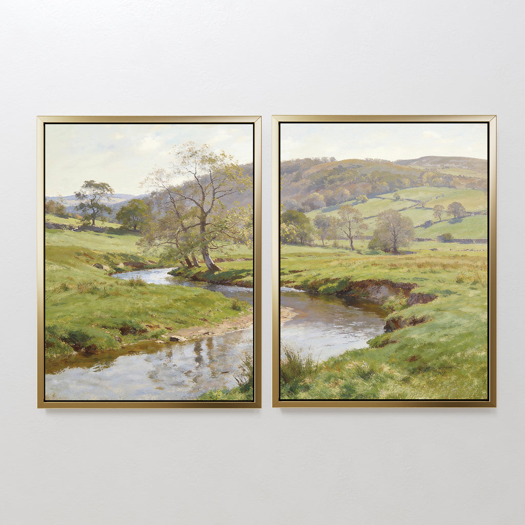 The "Valley Stream - Set of 2" features two framed prints capturing rolling green hills, a winding river, and a partly cloudy sky. Bright and serene, the countryside landscapes unfold across adjacent canvases for a harmonious display.