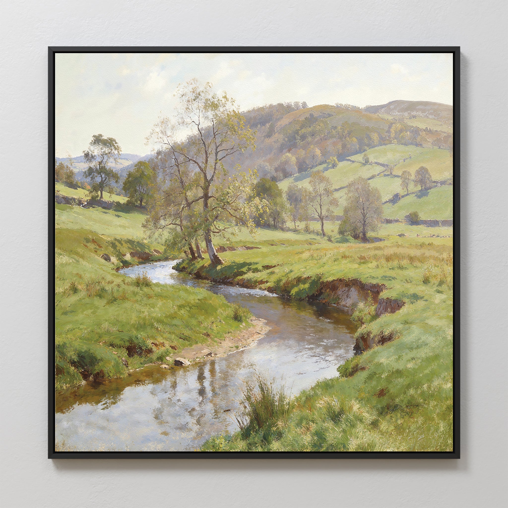 Valley Stream Canvas Art - Square: Framed art featuring a peaceful countryside with winding river, green fields, scattered trees, rolling hills, and bright sky reflected calmly in the water.