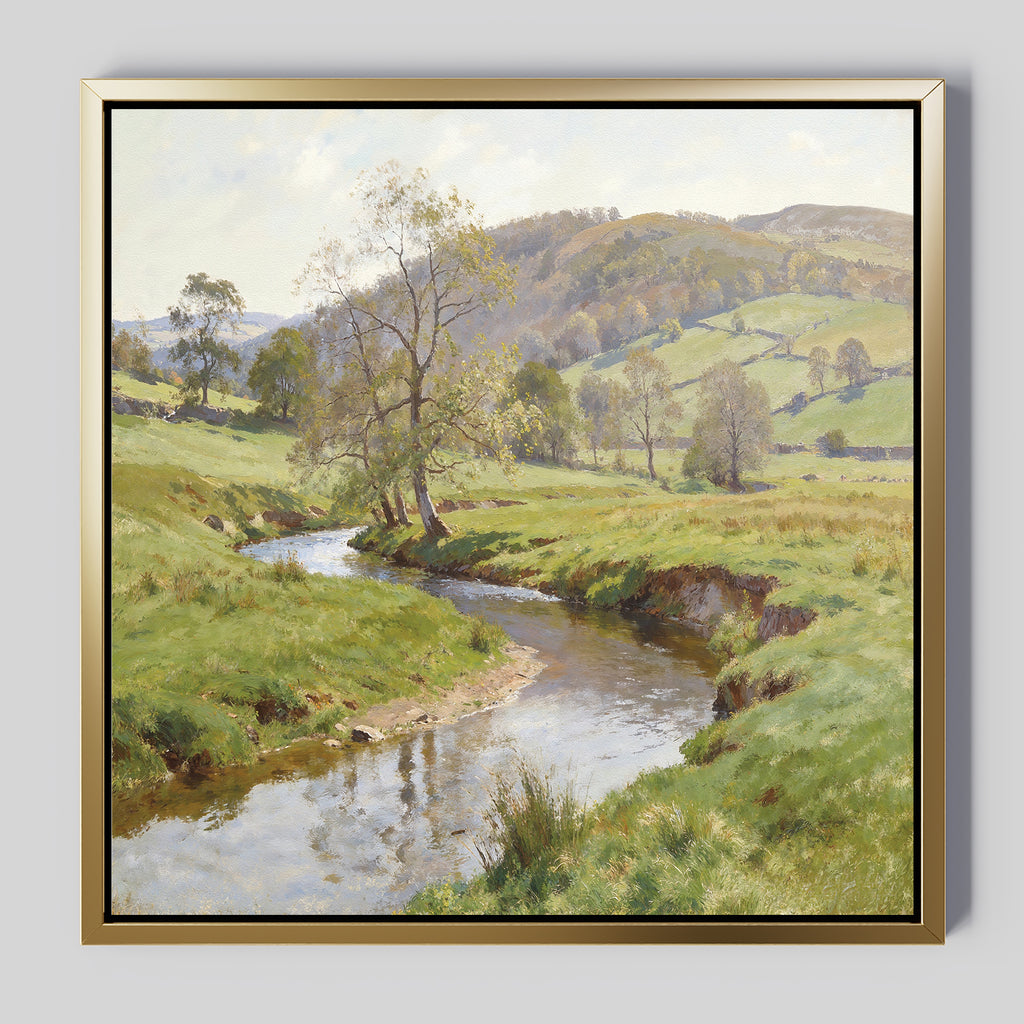The Valley Stream Canvas Art - Square features a tranquil countryside with a winding river, grassy fields, trees, and rolling hills beneath partly cloudy skies—an ideal accent for spaces seeking serene beauty.