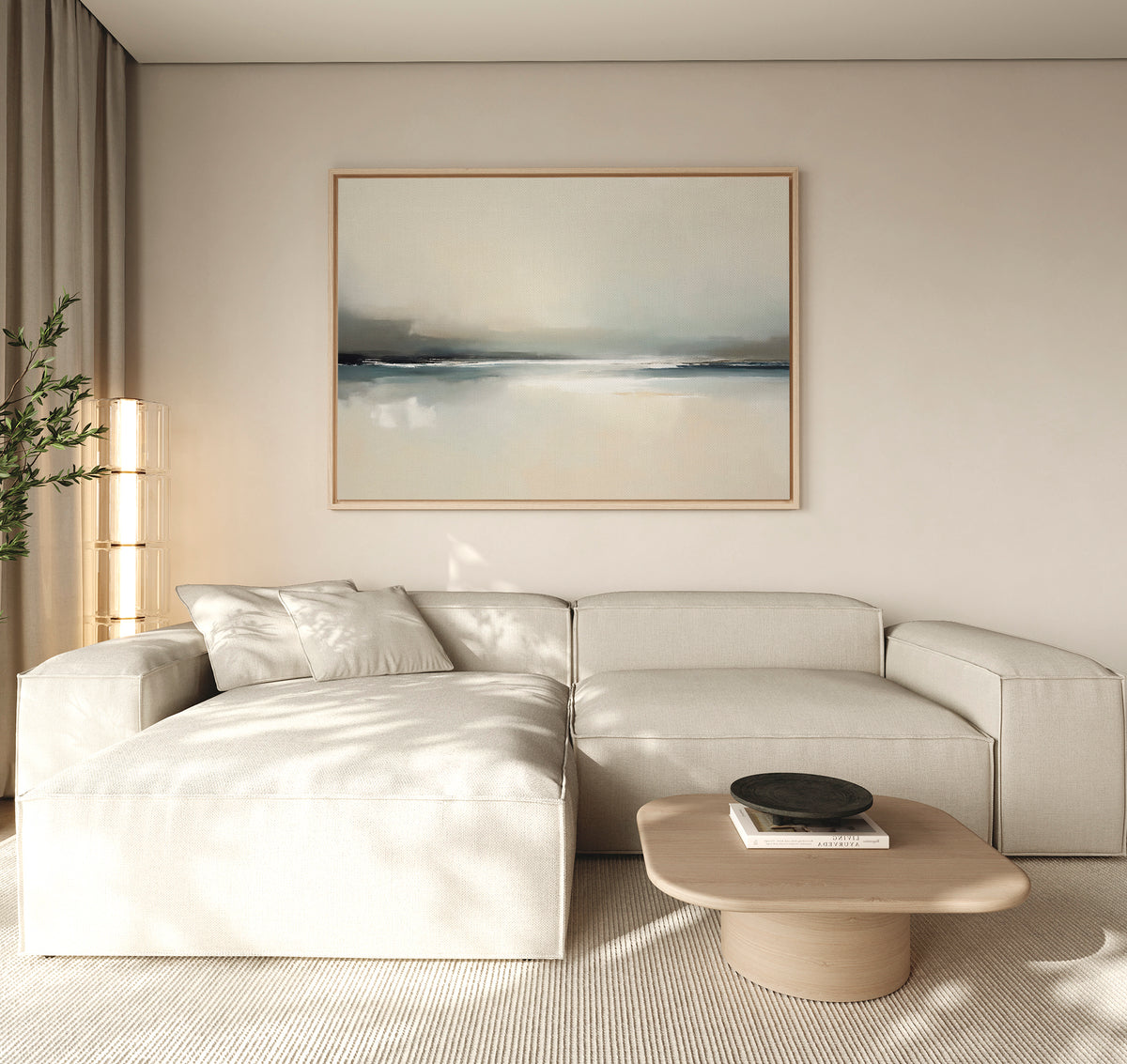 A modern living room with a light beige sectional, a square wooden coffee table with a dark bowl, and beige curtains, highlighted by the Veiled Estuary Canvas Art - Horizontal above the sofa.