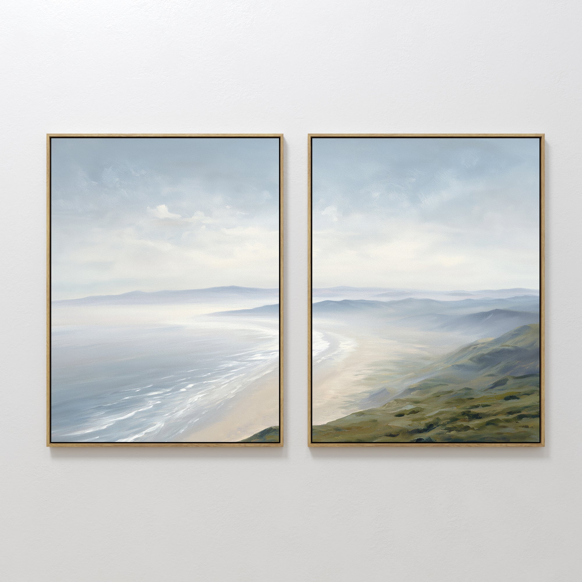 The "Veiled Shores - Set of 2" features framed wall art with serene coastal scenes—sandy beach, gentle waves, and rolling green hills under a cloudy sky—using soft, muted colors for a peaceful atmosphere.