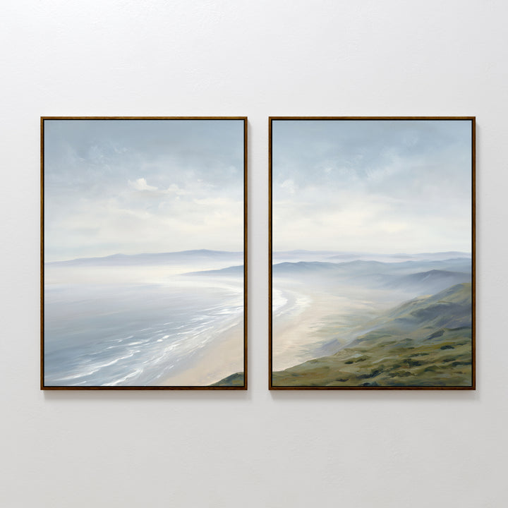The Veiled Shores - Set of 2 features framed coastal canvas paintings showing gentle waves, misty hills, and serene skies in calming blue and green tones, perfect for tranquil wall art.