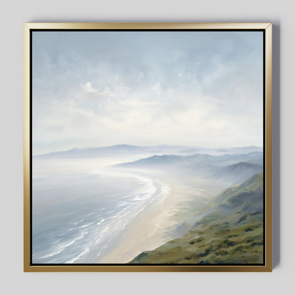 The Veiled Shores Canvas Art - Square features a misty coastal landscape with rolling hills, sandy shores, and calm ocean waves under a cloudy sky in cool blues and greens, bringing a peaceful and serene mood to any space.