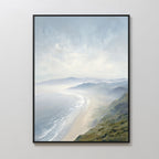 The Veiled Shores Canvas Art - Vertical features soft waves, sandy shores, and misty mountains under a cloudy sky, adding tranquil coastal style to any plain white wall.