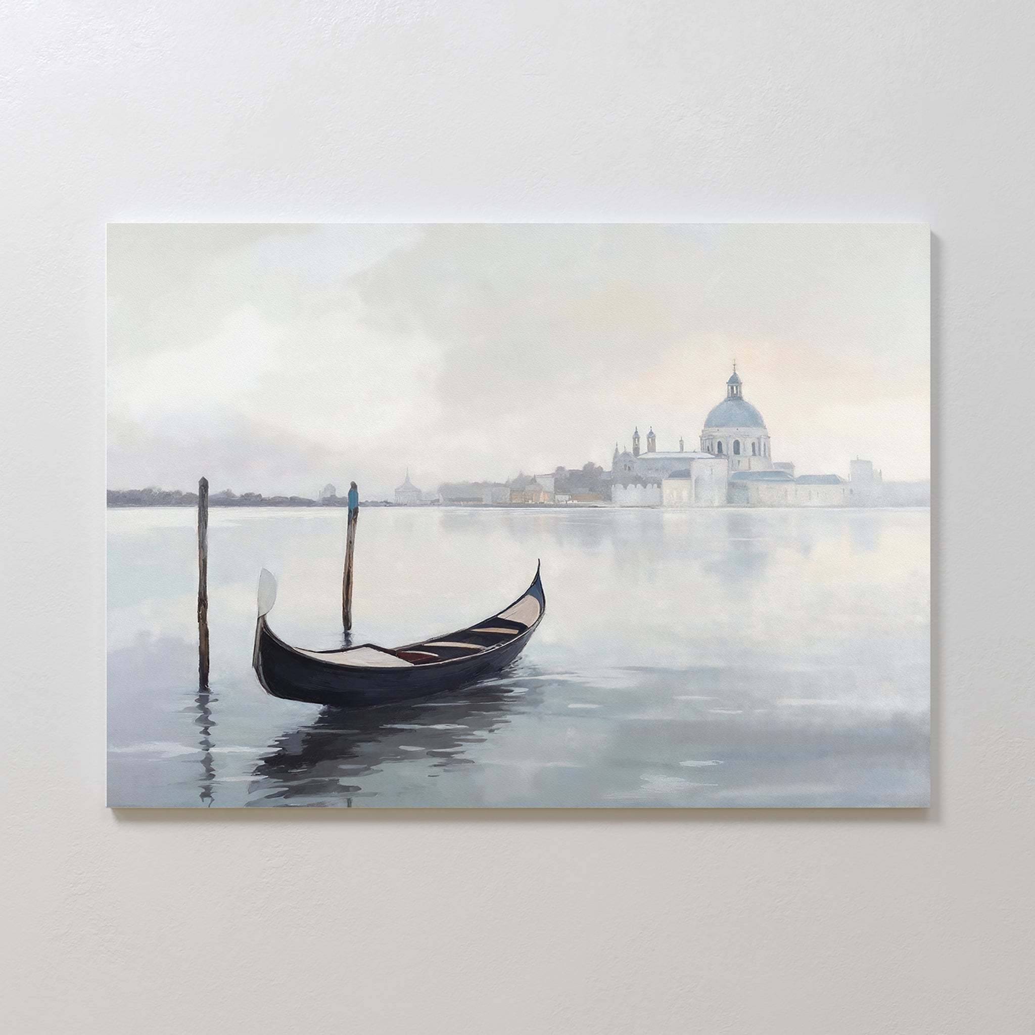 The Venetian Stillness Canvas Art - Horizontal shows a gondola on calm water near wooden posts with a hazy cityscape and domed buildings in the background, ideal as Venetian wall art for elegant European-inspired decor.