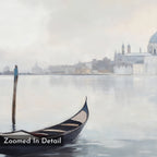 The Venetian Stillness Canvas Art - Horizontal features a gondola on calm water before a misty cityscape, finished with a soft, painted effect. "Zoomed In Detail" text accents this elegant piece, ideal for Venetian or European-inspired decor.