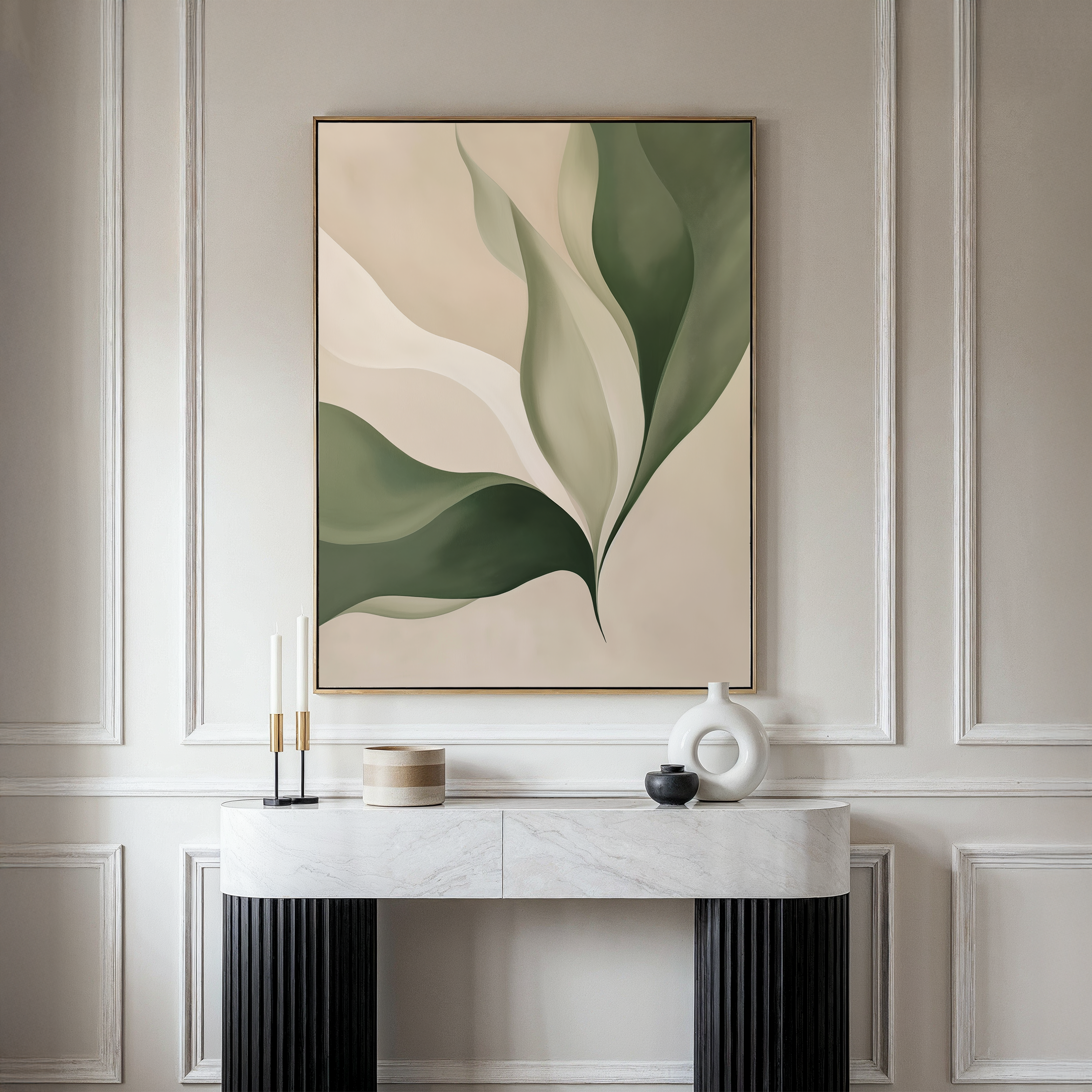 A modern console table with decorative objects stands against a cream paneled wall, topped by Verdant Grace—a large abstract painting with organic green and beige leaf shapes—perfect for living room decor.
