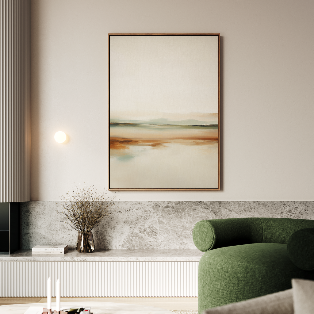 A modern living room features a green curved sofa, minimalist décor, a small vase with dried flowers, and the Earthly Hues Abstract Canvas Art—a large abstract landscape in earthy tones—hanging above a light stone bench.