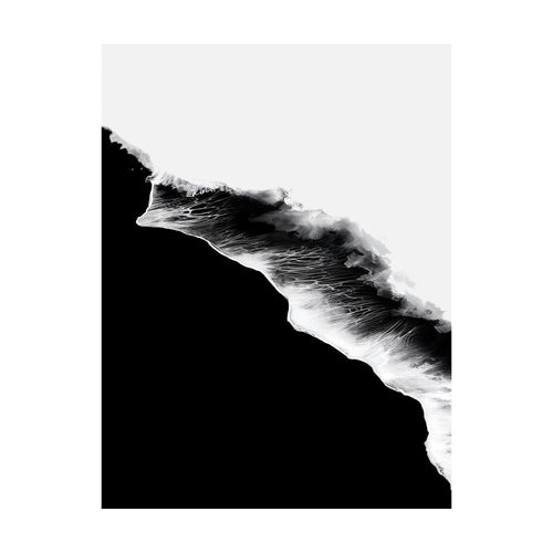 Black Ocean is a high-contrast black and white aerial view of a wave breaking against a shore, perfect as abstract wall art.