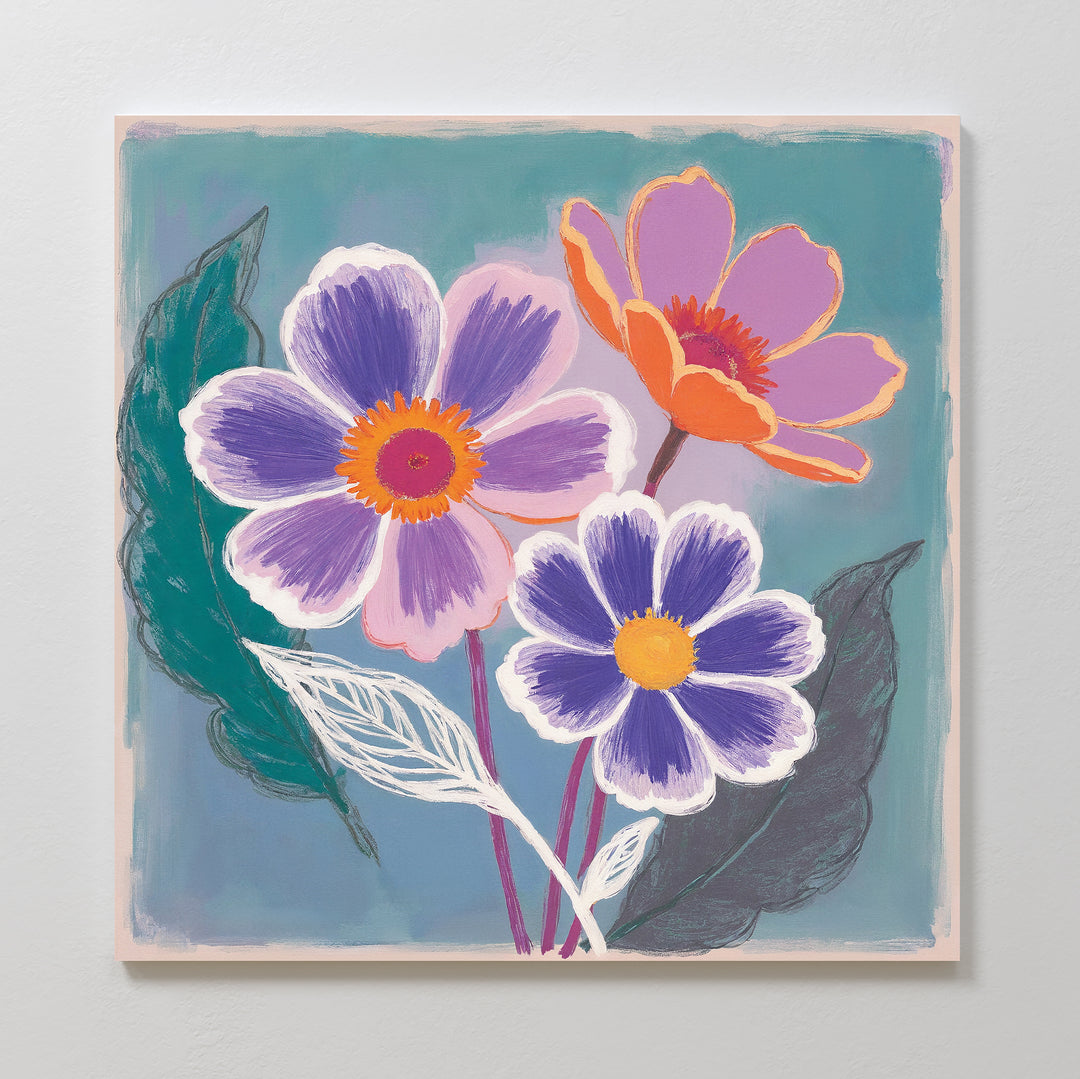Vibrant Petals Canvas Art - Square: A colorful botanical canvas print with three stylized flowers in purple, orange, and pink, surrounded by green and white leaves on a teal background—perfect vibrant wall art for any space.