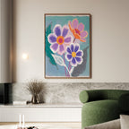 A modern living room with a green curved sofa, marble shelf, and the Vibrant Petals Canvas Art - Vertical—a bold painting of three abstract flowers in purple, pink, and orange—hanging on a light wall.