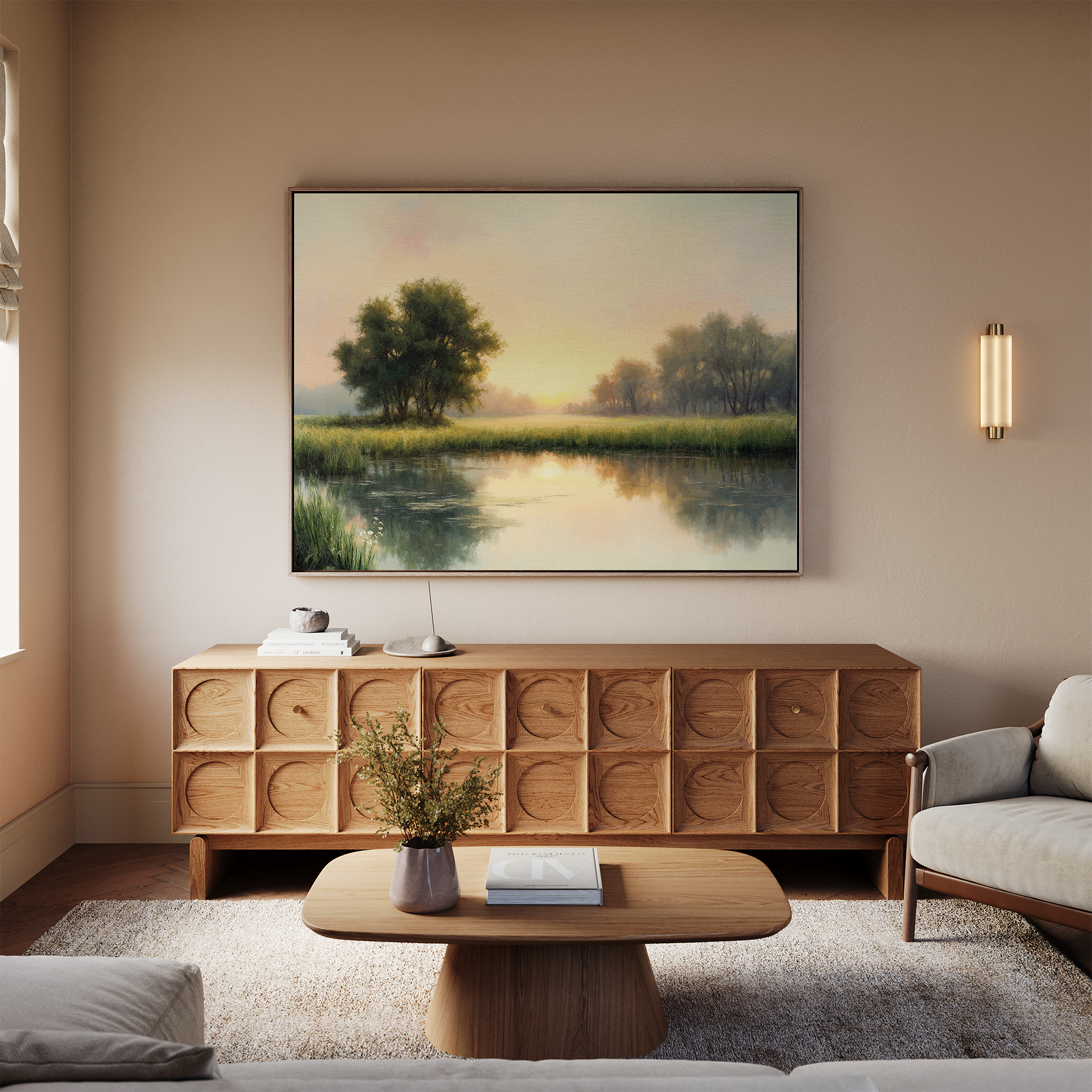 A cozy living room with a wooden sideboard, a coffee table with a vase, and a beige sofa. The Journey Canvas Art hangs above the sideboard, depicting a serene sunrise over a river and trees, enhancing the inviting countryside decor.