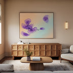 A modern living room featuring the Violet Dreams Canvas Art - Horizontal on the wall, a wooden sideboard, beige sofa, light wood coffee table with a vase of flowers, and calm neutral-toned decor.