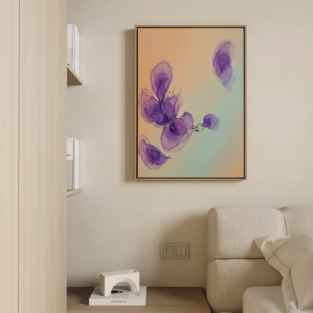 The Violet Dreams Canvas Art - Vertical, a framed violet abstract floral print, hangs on a beige wall above a cream sofa with a light wood shelf nearby, creating Nordic Park-inspired botanical wall art appeal.