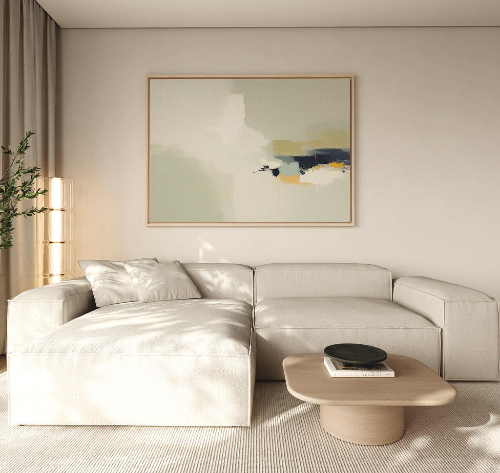 Minimalist living room featuring a beige sectional, light wood coffee table, neutral walls, floor-to-ceiling curtains, a tall corner plant, and modern elegance highlighted by Weathered Composition Canvas Art - Horizontal above.