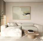 Minimalist living room featuring a beige sectional, light wood coffee table, neutral walls, floor-to-ceiling curtains, a tall corner plant, and modern elegance highlighted by Weathered Composition Canvas Art - Horizontal above.