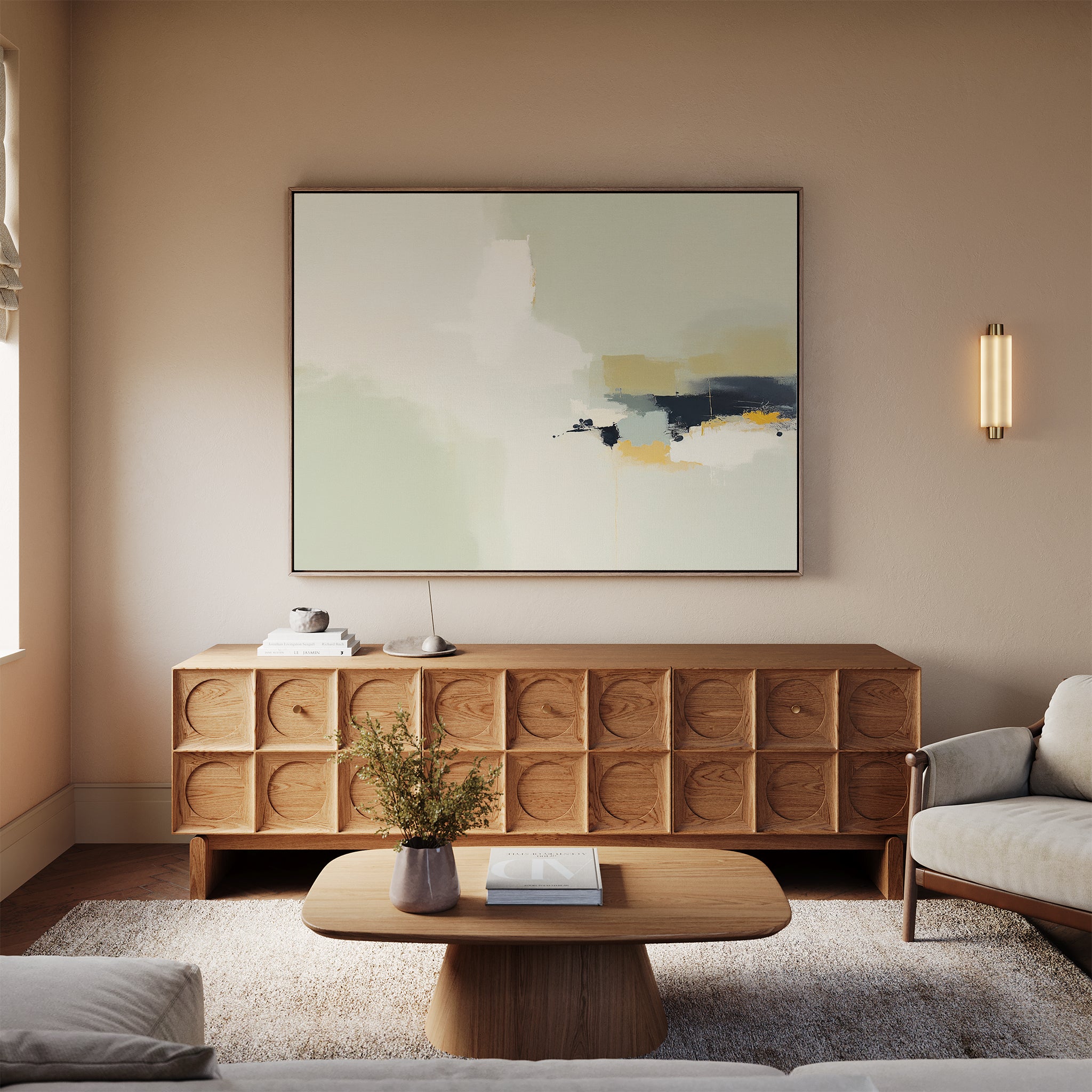 A modern living room with light walls, a Weathered Composition Canvas Art - Horizontal as an abstract print, a wooden sideboard with circular patterns, matching coffee table, white sofa, wall sconce, and a vase with flowers on the table for elegance.