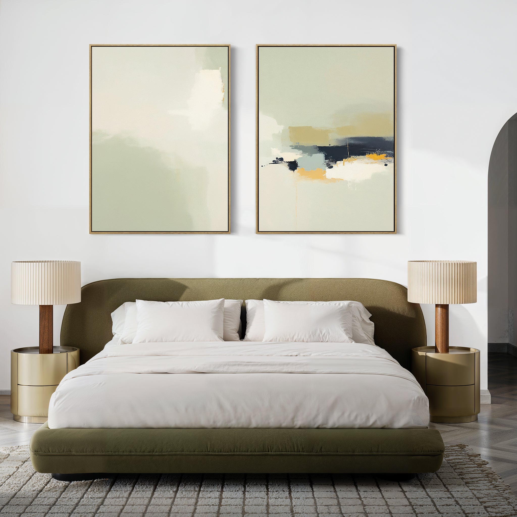 A modern bedroom featuring an olive green upholstered bed with white bedding, two beige nightstands topped with matching lamps, and the Weathered Composition - Set Of 2 abstract prints in soft colors above the bed for a modern touch.