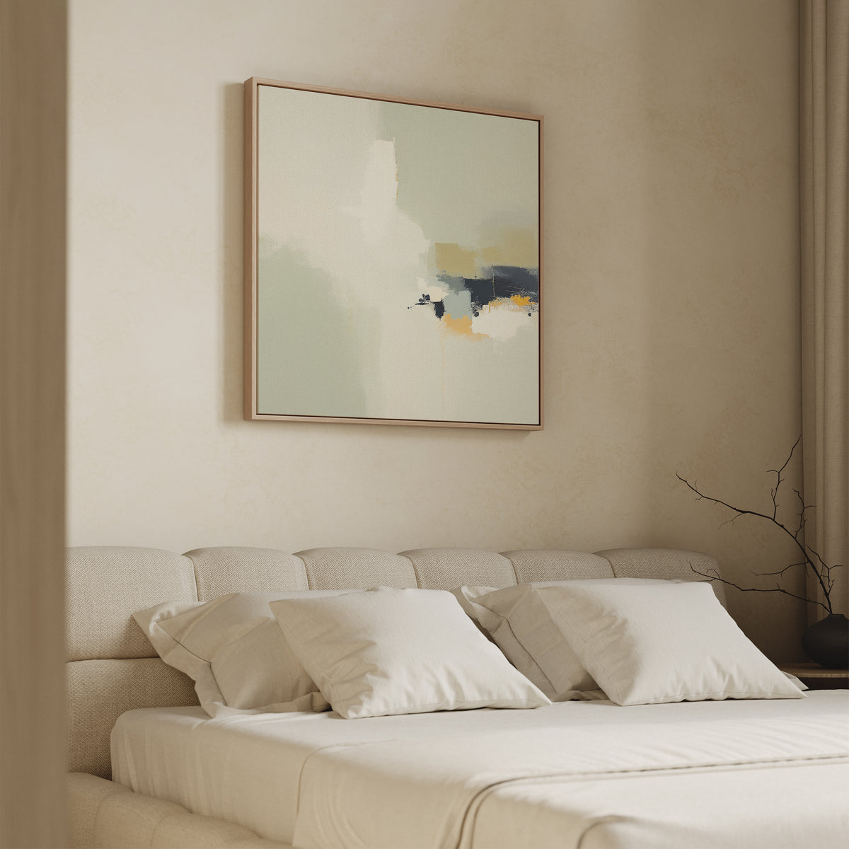 A modern, minimalist bedroom features a beige upholstered bed with white pillows and bedding. Above the headboard hangs the Weathered Composition Canvas Art - Square, while a bare branch on the side table enhances the contemporary elegance.