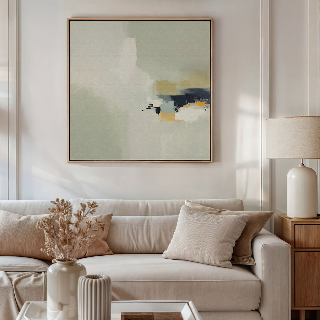 A modern living room with a white sofa, beige cushions, a side table and lamp, dried flowers in a vase, and the Weathered Composition Canvas Art - Square adding modern elegance above the sofa.