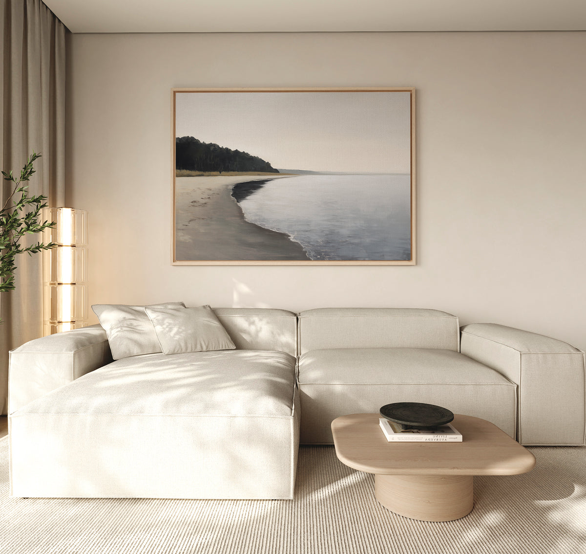 Minimalist living room featuring a light beige sectional, wooden coffee table with a decorative bowl, and the Weathered Shore Canvas Art - Horizontal on the wall. Beige curtains diffuse soft natural light for a tranquil vibe.