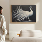 A woman in white admires the White Peacock Display Canvas Art - Horizontal, elegantly framed and displayed above a beige sofa in a modern, softly lit living room.