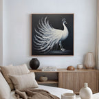 A modern living room with a beige sofa and wooden sideboard, accented by neutral cushions and ceramics. The White Peacock Display Canvas Art - Square hangs as a striking focal point on the wall.