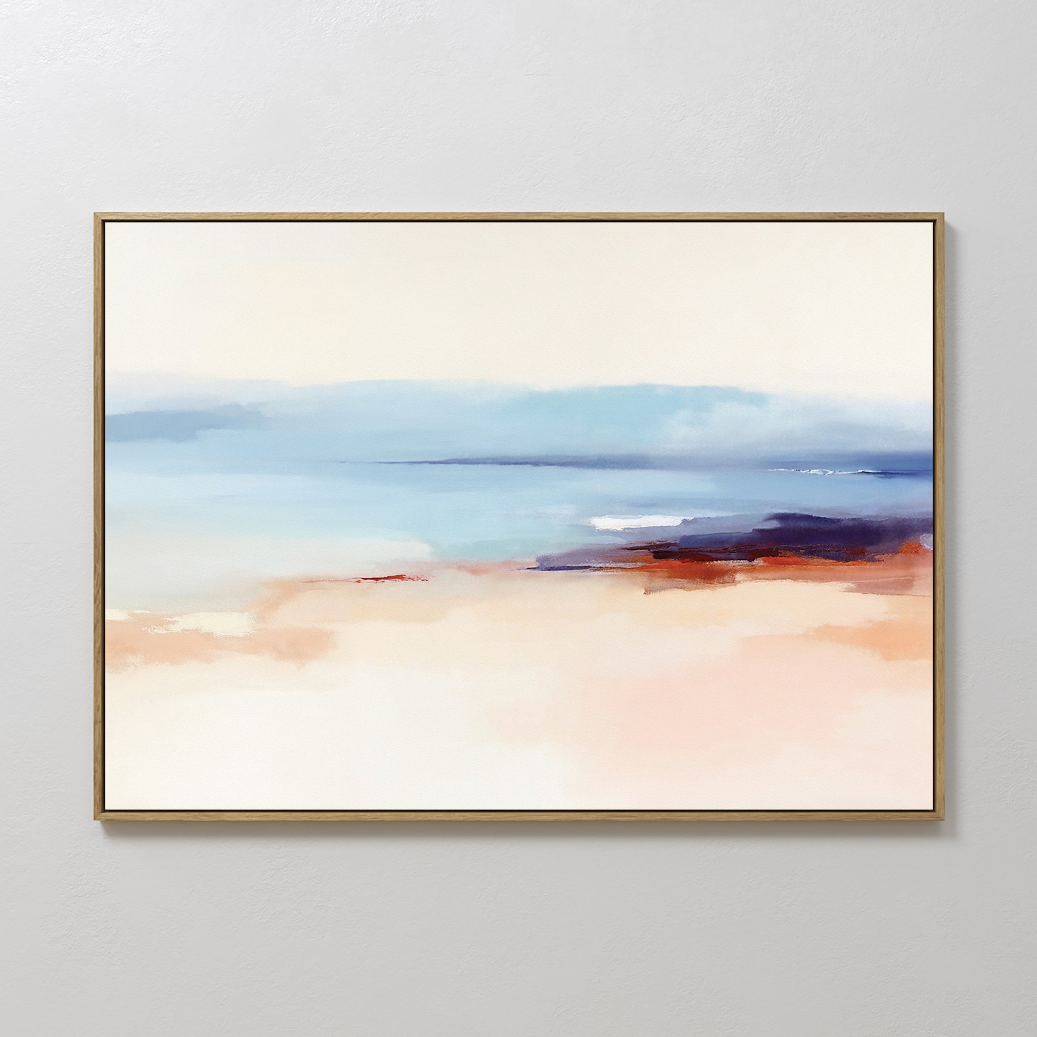 Windswept Coastline Canvas Art - Horizontal features soft, blended colors with pale sandy and peach tones fading into blue and indigo, evoking a tranquil sea and sky. Thinly framed, it's perfect as calming coastal wall art.