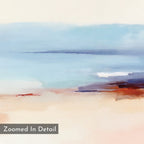 The Windswept Coastline Canvas Art - Horizontal features soft blue, white, and mauve hues blending into sandy beige and rust-red tones. This serene coastal print has “Zoomed In Detail” overlay text in a gray box.