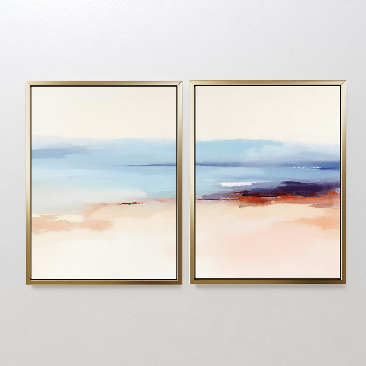 The "Windswept Coastline - Set Of 2" features abstract gold-framed prints with soft blue, beige, peach, and white tones—serene wall art for anyone seeking elegant coastal style in a modern interior.