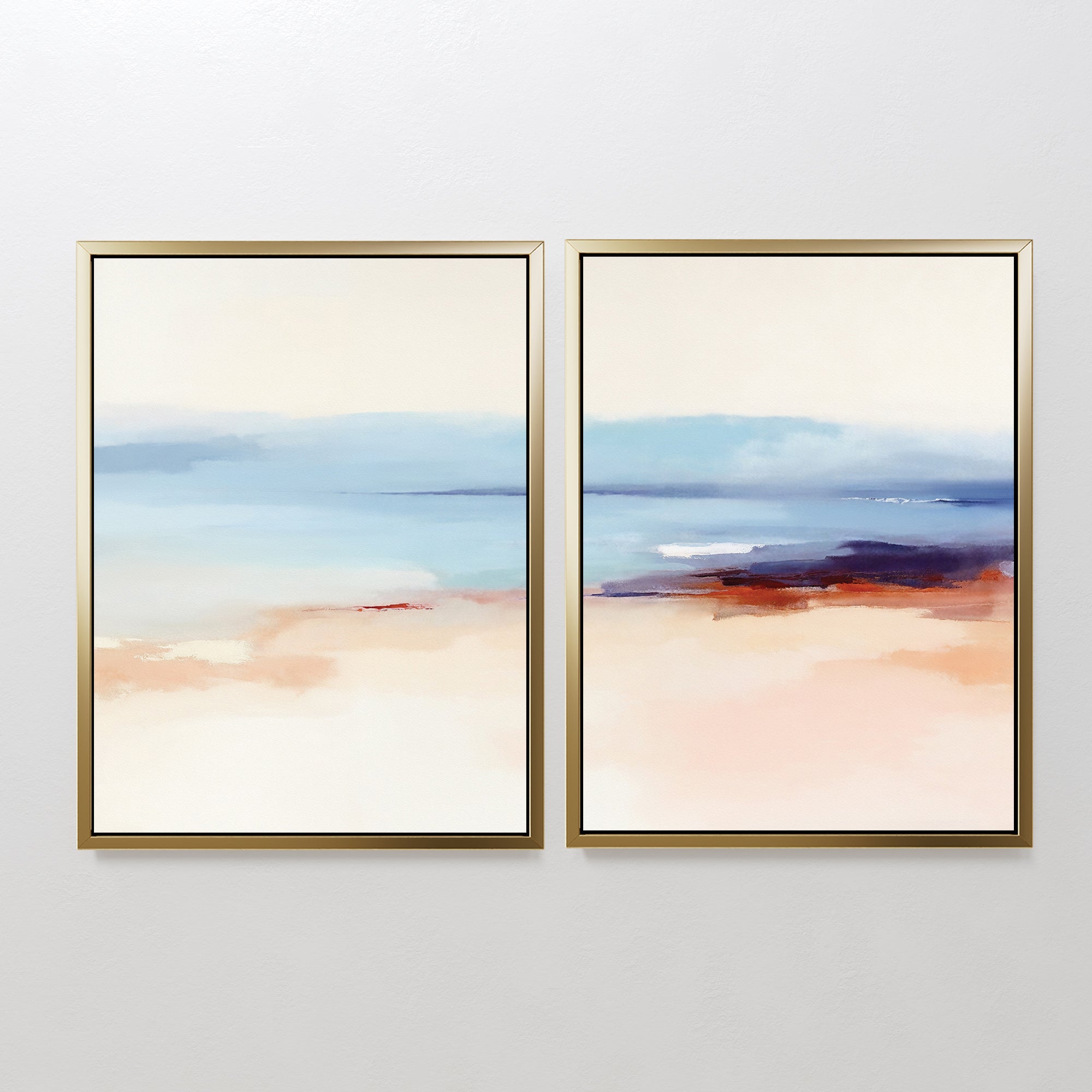 The "Windswept Coastline - Set Of 2" features abstract gold-framed prints with soft blue, beige, peach, and white tones—serene wall art for anyone seeking elegant coastal style in a modern interior.