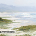 A tranquil beach scene with soft hues features sandy shores, gentle waves, grass-covered dunes, and distant mountains beneath a hazy sky. "Zoomed In Detail" appears in the corner on the Windswept Dunes Canvas Art - Horizontal.